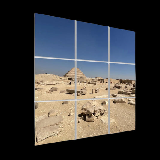 Left-angle view of Step Pyramid acoustic wall panels with desert ruins in the foreground and ancient architecture extending into the distance.