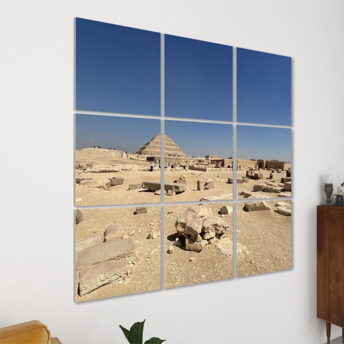 Left-angle view of Step Pyramid acoustic wall panels with desert ruins in the foreground and ancient architecture extending into the distance.