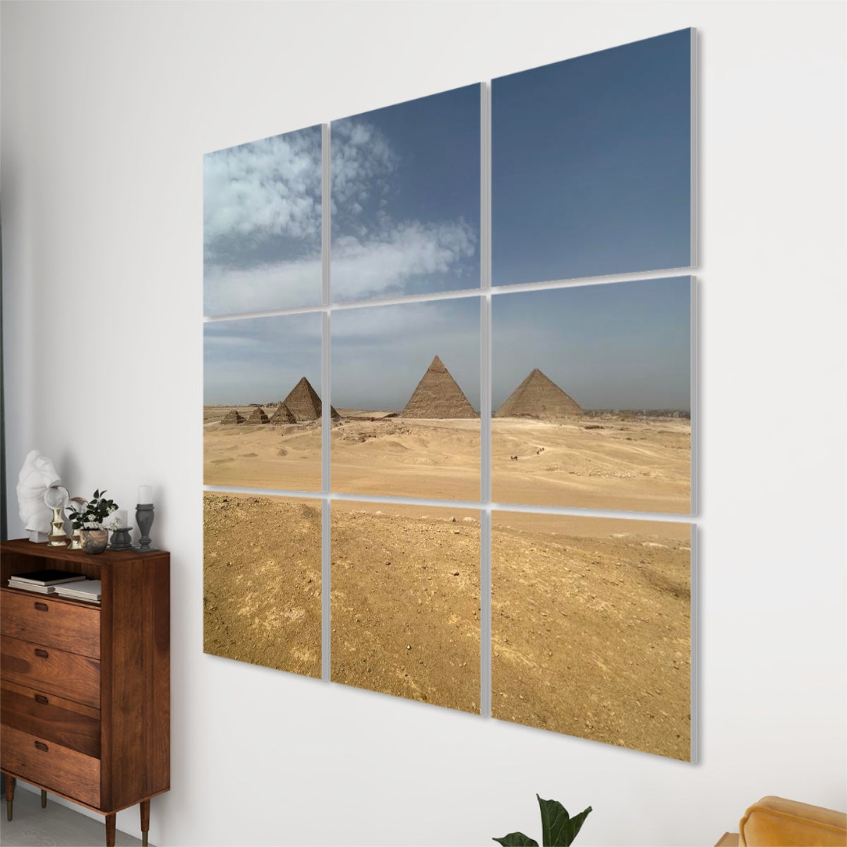 Right-side angled view of 9-panel sound-absorbing wall art featuring the Giza pyramids with soft lighting and textured desert foreground.