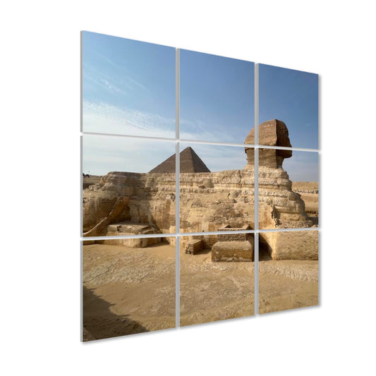 Left-side angled view of Sphinx and Pyramid acoustic wall art showing panel depth and warm sandstone tones across the 9-panel layout.