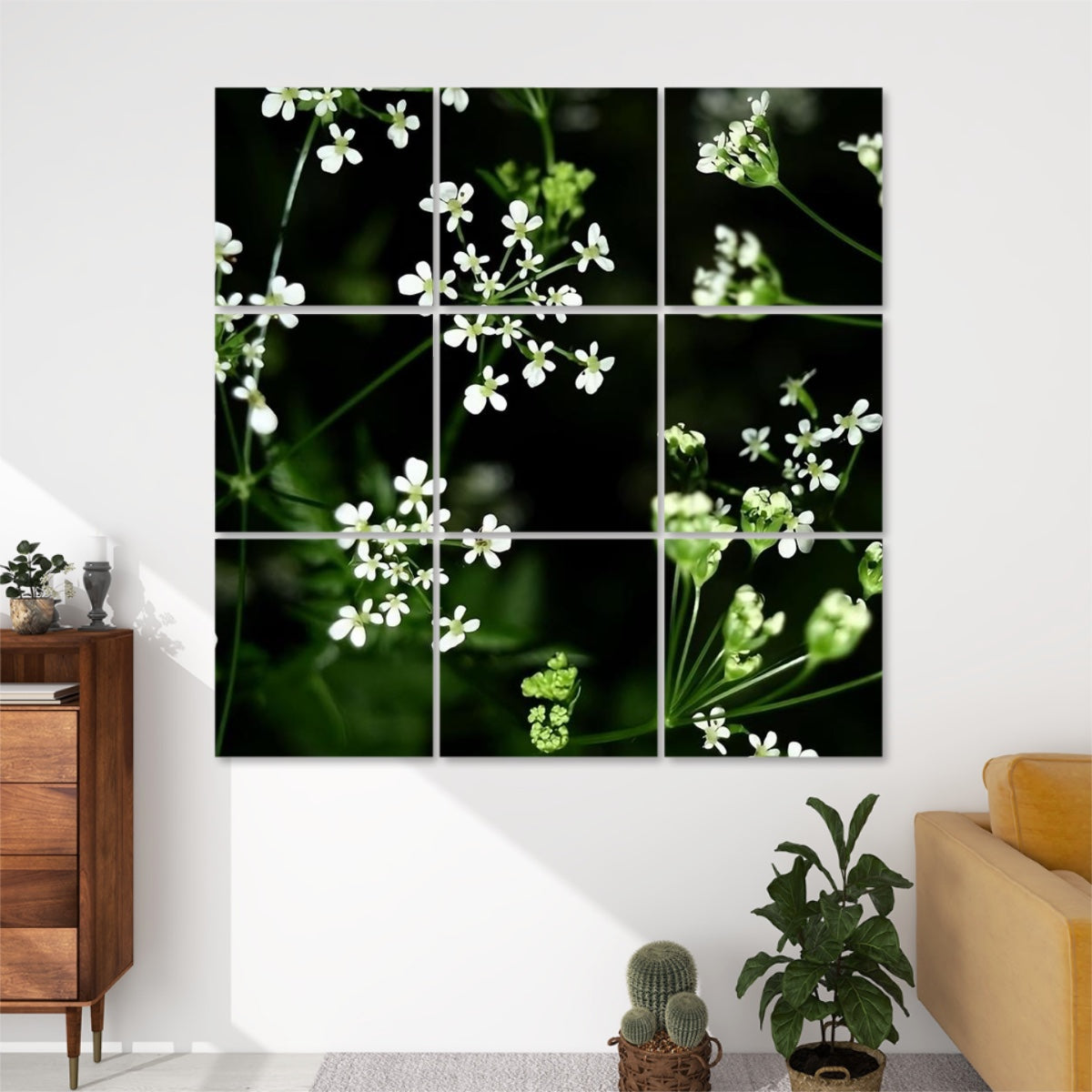 Front view of 9-panel acoustic wall art featuring delicate white wildflowers against a deep green background in a natural, airy composition.