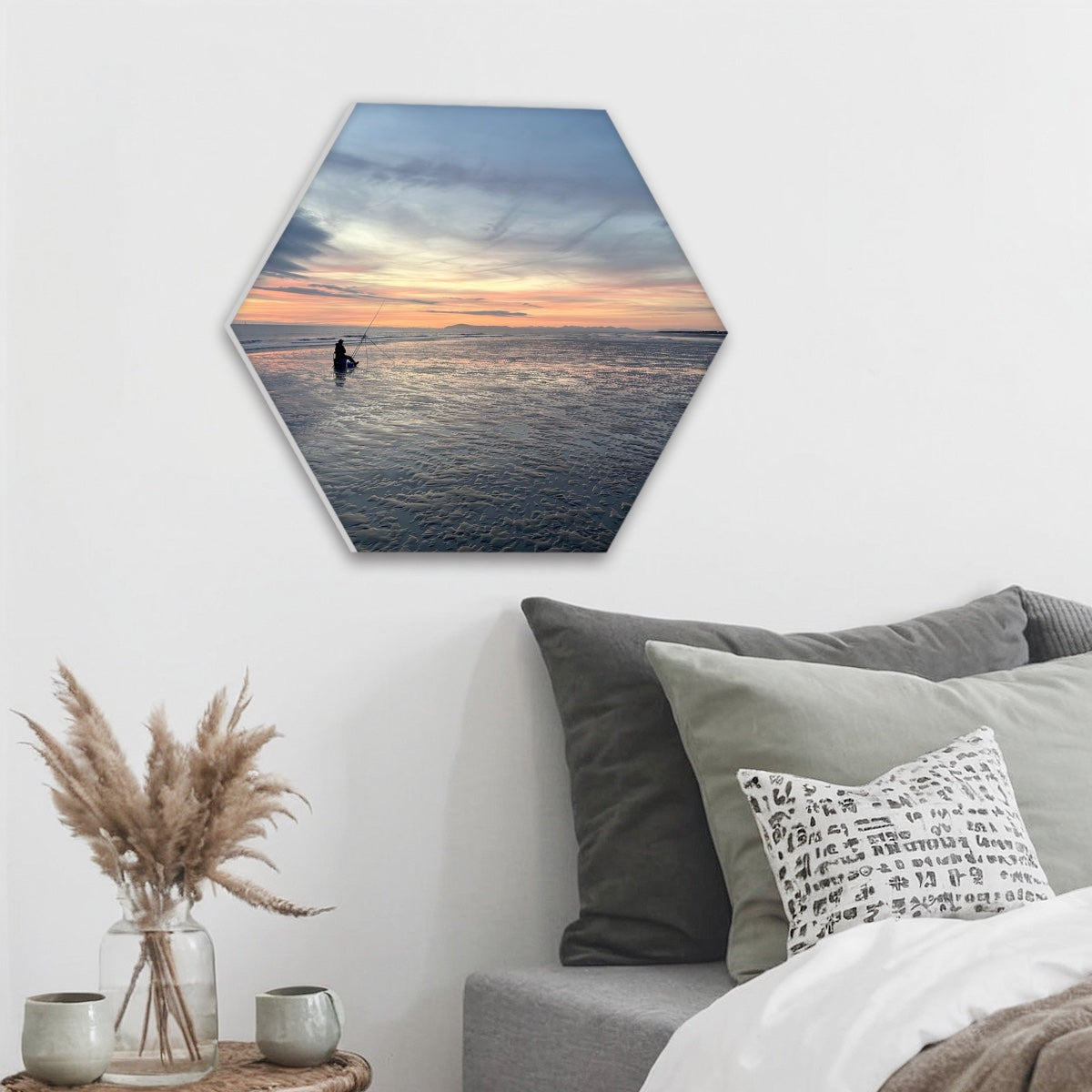 Single Hexagon Sound absorbing Wall Panel featuring Beach Sunset by Papi's Canvas displayed above couch with pillows