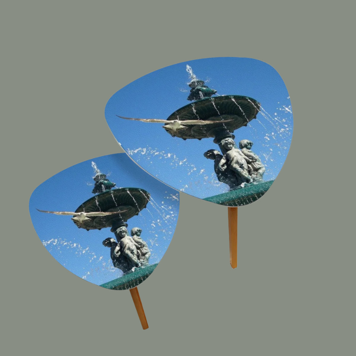 set of 2 triangular coffee tables featuring seagull in flight with Lisbon blue sky in the background