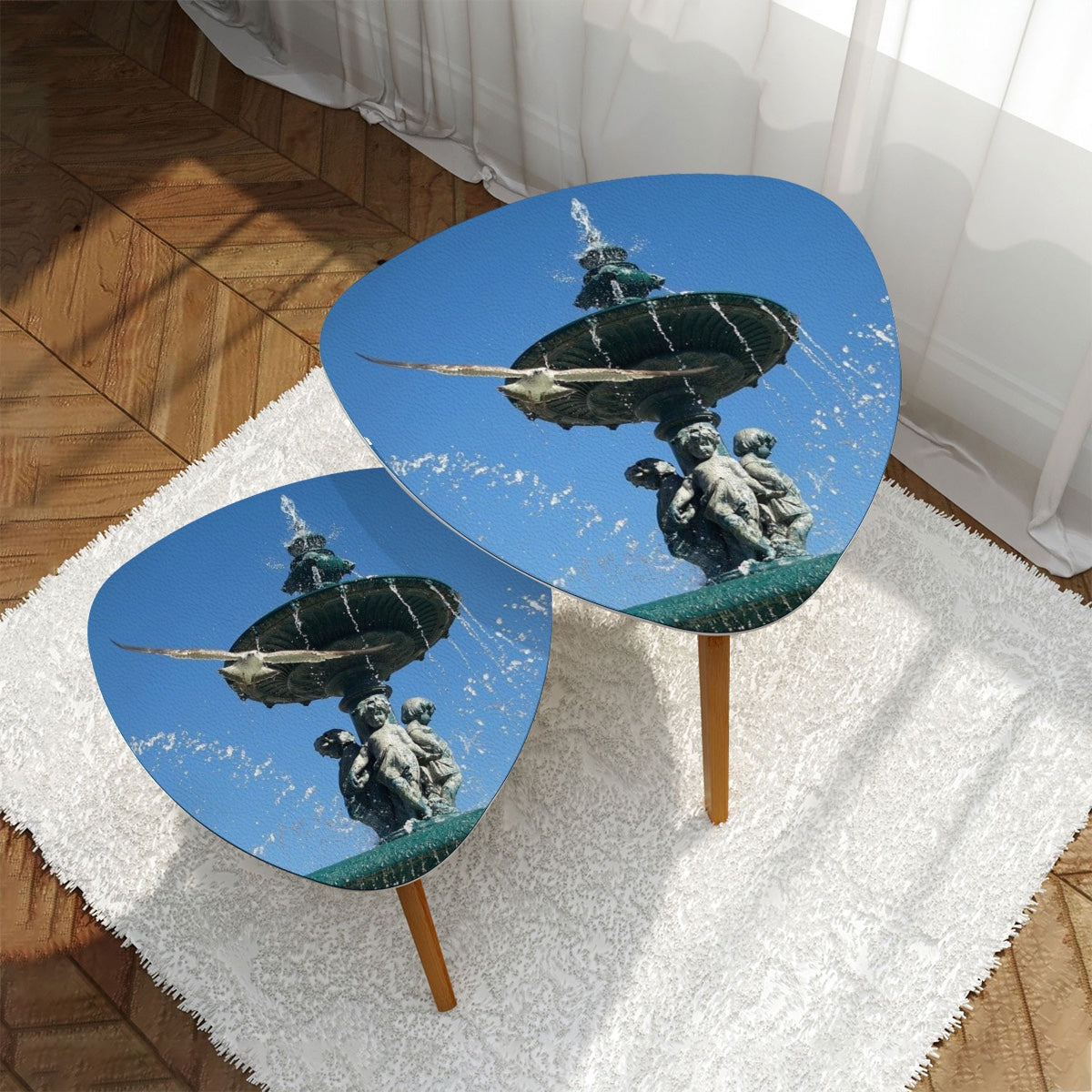 set of 2 triangular coffee tables featuring seagull in flight with Lisbon blue sky in the background