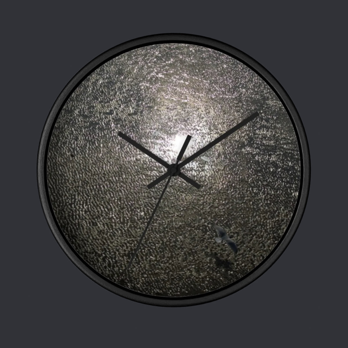 wall clock featuring reflection of sun in the Blackpool beach with seagull flying over it, base: black, handles: black, size: 10''