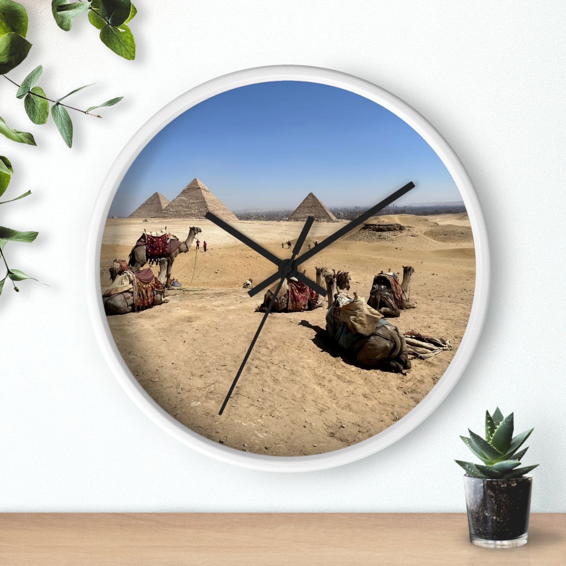 wall clock featuring camels resting in front of Pyramids of Giza, base: white, handles: black, size: 10''
