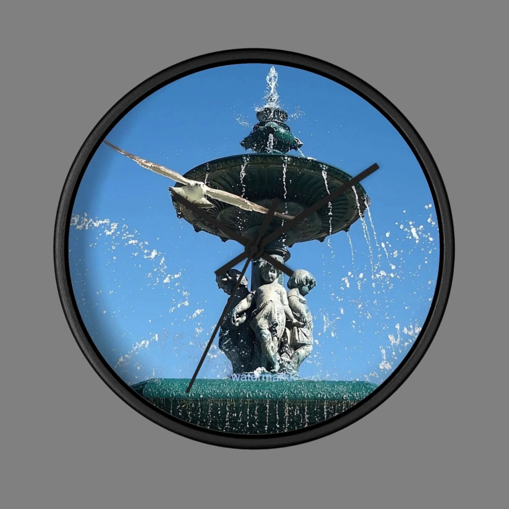 Wall Clock featuring seagull in flight with fountain in Lisbon in background, base: black, handles: black: size: 10''