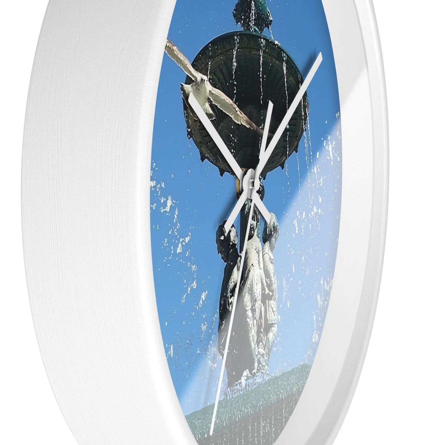Wall ClWall Clock featuring seagull in flight with fountain in Lisbon in background, base: white, handles: white, size: 10''