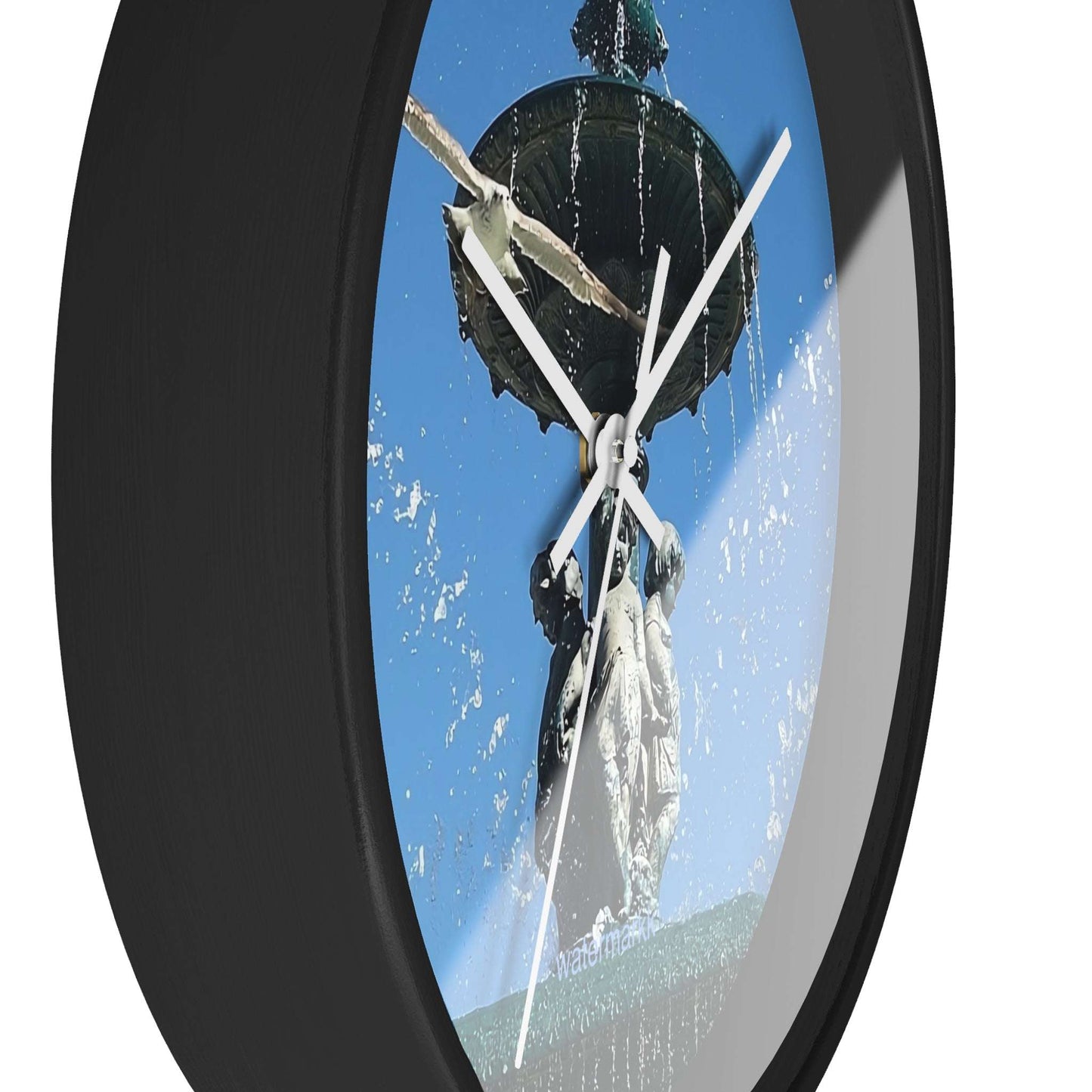 Wall ClWall Clock featuring seagull in flight with fountain in Lisbon in background, base: black, handles: white, size: 10''