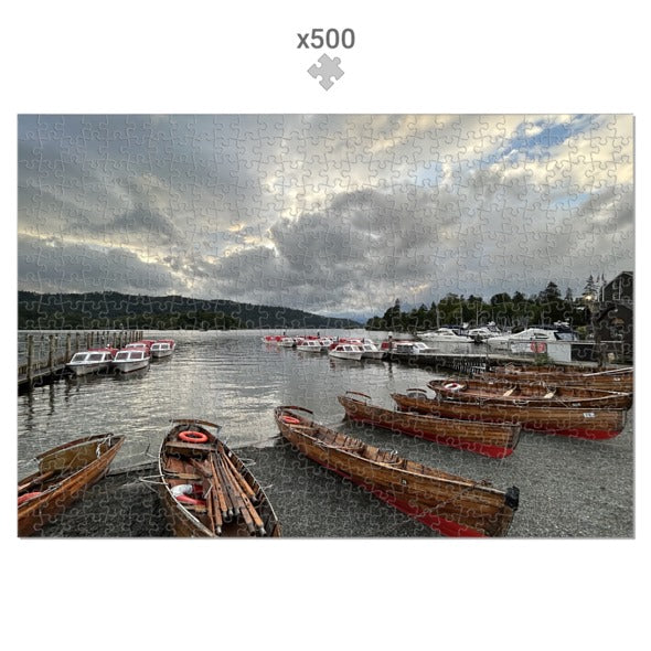 Made in UK Windermere Boats Sustainable Jigsaw Puzzle showing wooden boats docked by the lake under a cloudy sky