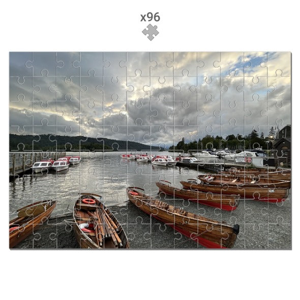 Made in UK Windermere Boats Sustainable Jigsaw Puzzle showing wooden boats docked on lake under cloudy sky