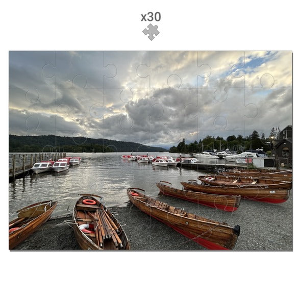 Made in UK Windermere Boats Sustainable Jigsaw Puzzle showing wooden boats docked on a lake under cloudy sky