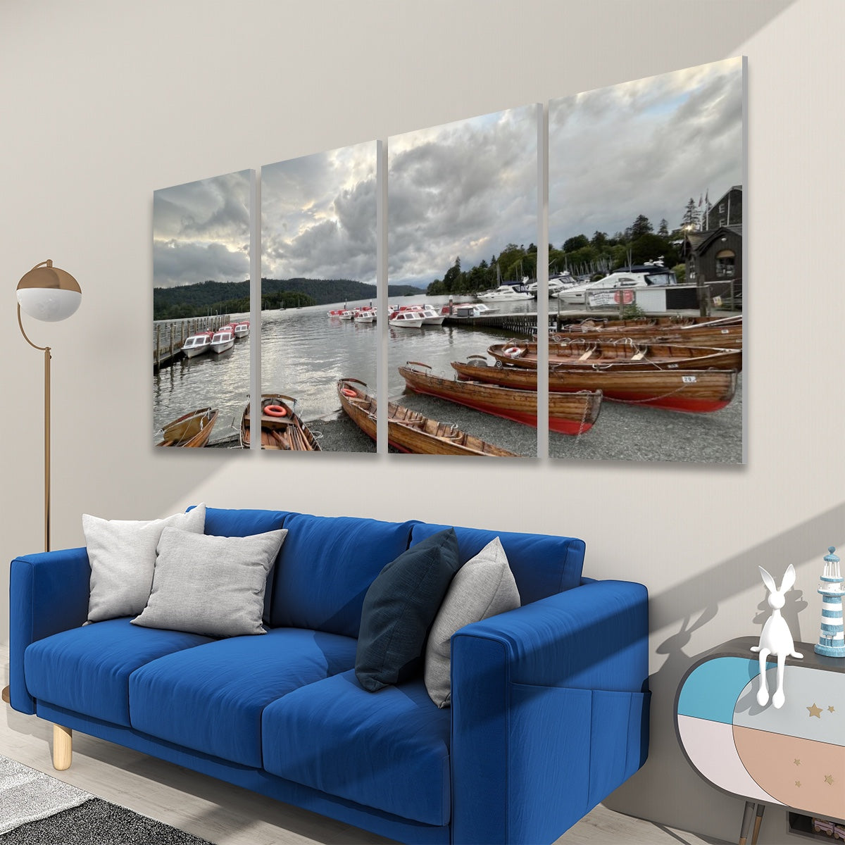 Lake District 4 Decorative Sound Absorbing Wall Panels showing boats on lake mounted above blue sofa