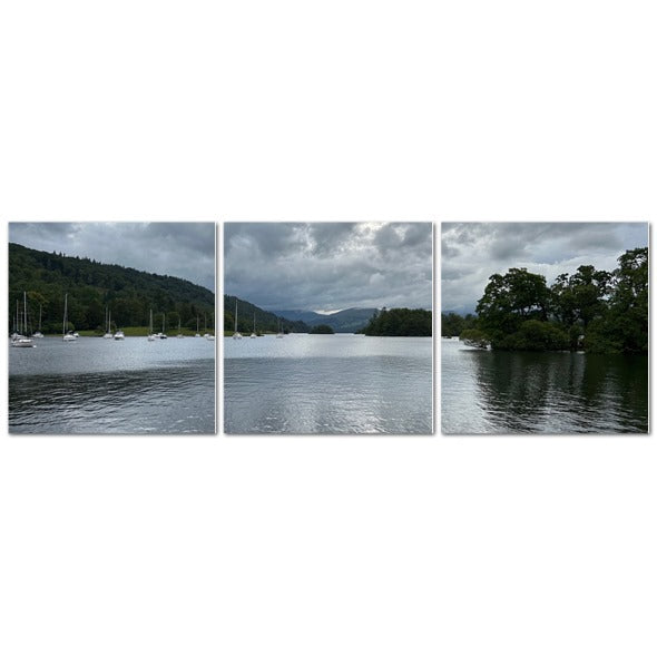 Windermere Lake Landscape Made in UK Triptych Canvas showing wooden rowboats and pleasure boats at a dock under cloudy sky