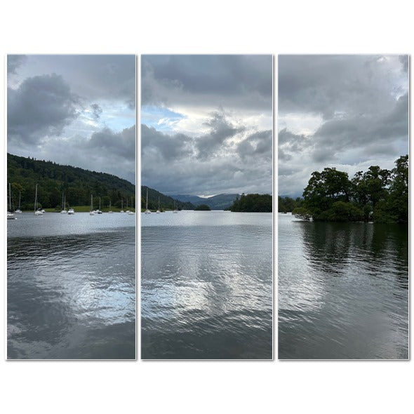 Windermere Lake Landscape Made in UK Triptych Canvas showing wooden rowing boats on shore with cloudy sky and dock