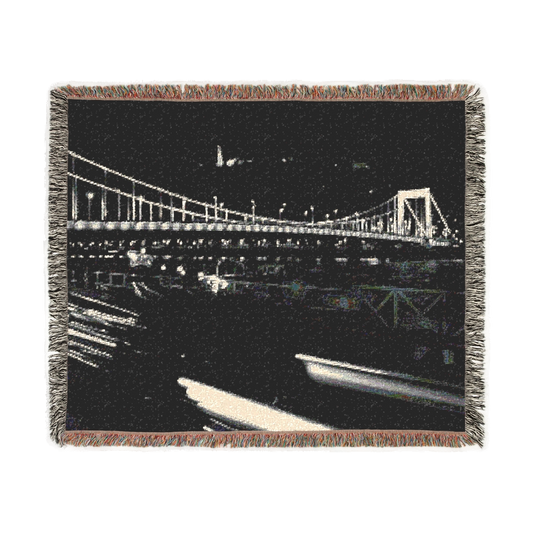 woven blanket featuring bridge in Budapest with Citadel in the background and car in foreground black and white long exposure size: 60''x50''