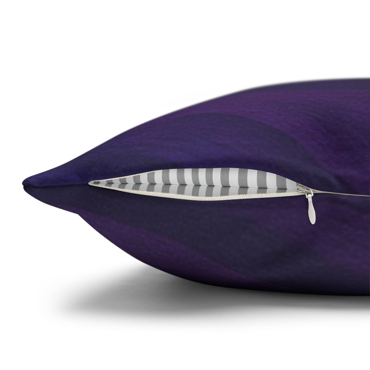 Close-up of the concealed beige zipper and metal pull on a Gilded Amethyst pillowcase against a white background