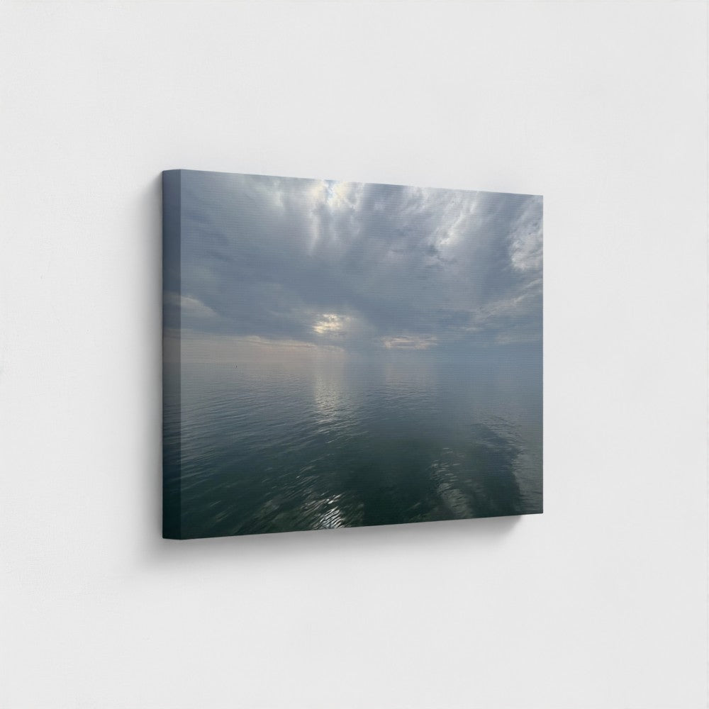 30''x20'' side-angle view of a sustainable canvas art featuring clouds mirrored on calm water