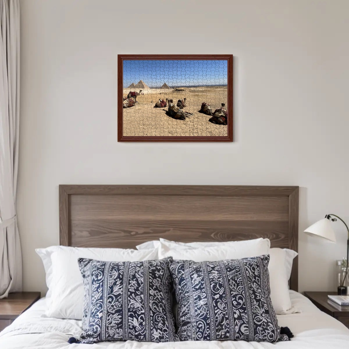 500-piece basswood puzzle of camels resting in the desert on Giza Plateau with pyramids and city in full color