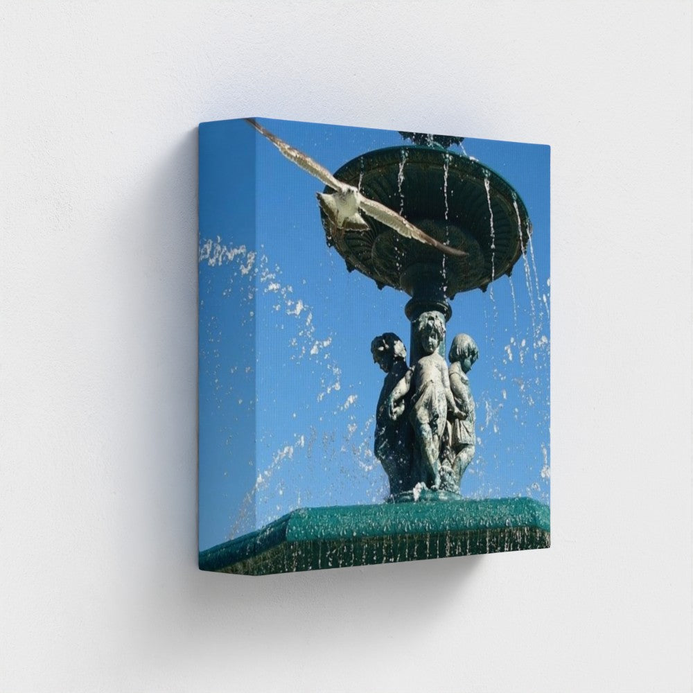 eco-friendly recycled canvas print showing a seagull and fountain from the side with water droplets and deep blue backdrop