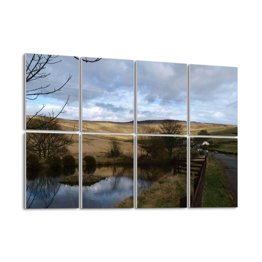 Left-angle view of full color 8-panel British Countryside wall art showing soft hill textures, pond reflections, and leafless trees.