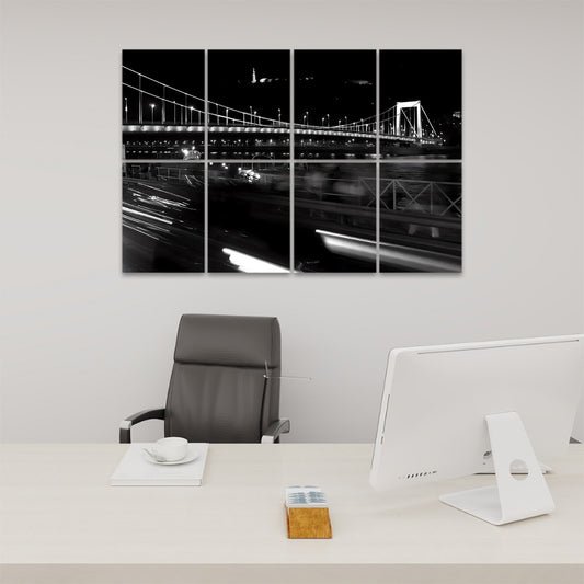 Front view of 8-panel acoustic wall art showing a Budapest bridge at night with light trails and illuminated buildings under a deep blue sky.
