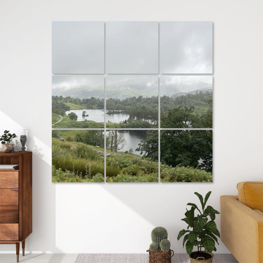 9 Decorative Sound Absorbing Wall Panels Featuring Tarn Hows Lake. 3x3 canvas grid of misty lake landscape above sofa