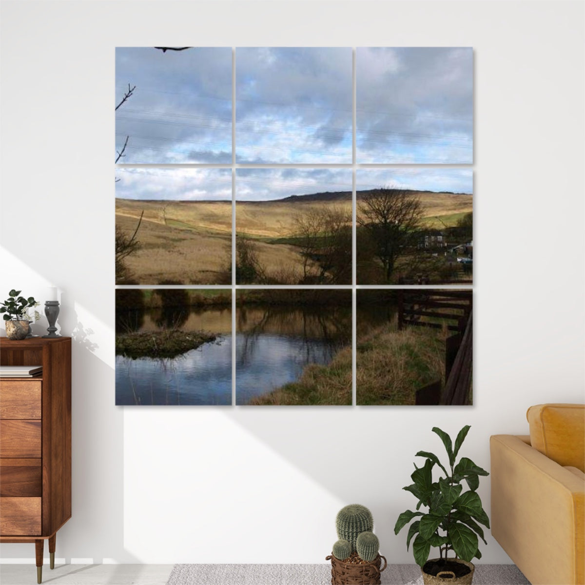 Front view of 9-panel acoustic wall art featuring a British countryside scene with golden hillside, bare trees, a pond with reflections, and a moody sky.