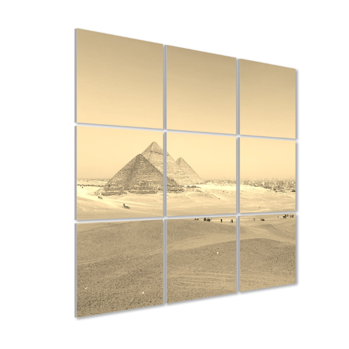 Left-angle view of sepia-toned Distant Pyramids 9-panel acoustic wall art, showing warm aged tones and atmospheric depth across the desert.