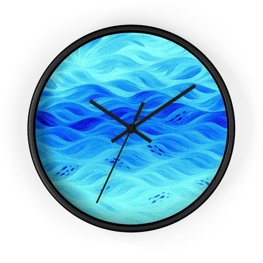 Round wooden wall clock with a painted black frame, black hour/minute/second hands, and a plexiglass face printed in gradient teal-to-sky-blue undulating waves