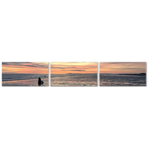 Beach Sunset Landscape Made in UK Triptych Canvas showing three panel panoramic beach sunset with fisherman silhouette