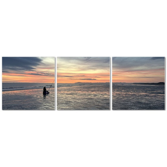 Beach Sunset Landscape Made in UK Triptych Canvas showing silhouetted fisherman on shore across three panels