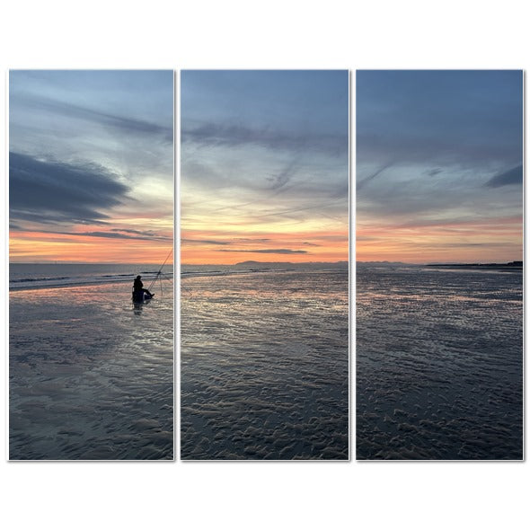 Beach Sunset Landscape Made in UK Triptych Canvas showing three panels of sunset over wet sand with fisherman