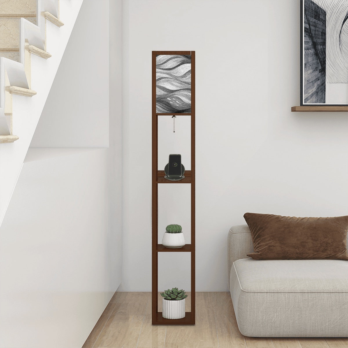 Walnut-finish wood floor lamp with three square shelves displaying a vase and books, topped by a linen cube shade in bold black-and-white wavy abstract design. A metal pull-chain switch and black power cord are visible beneath the shade.