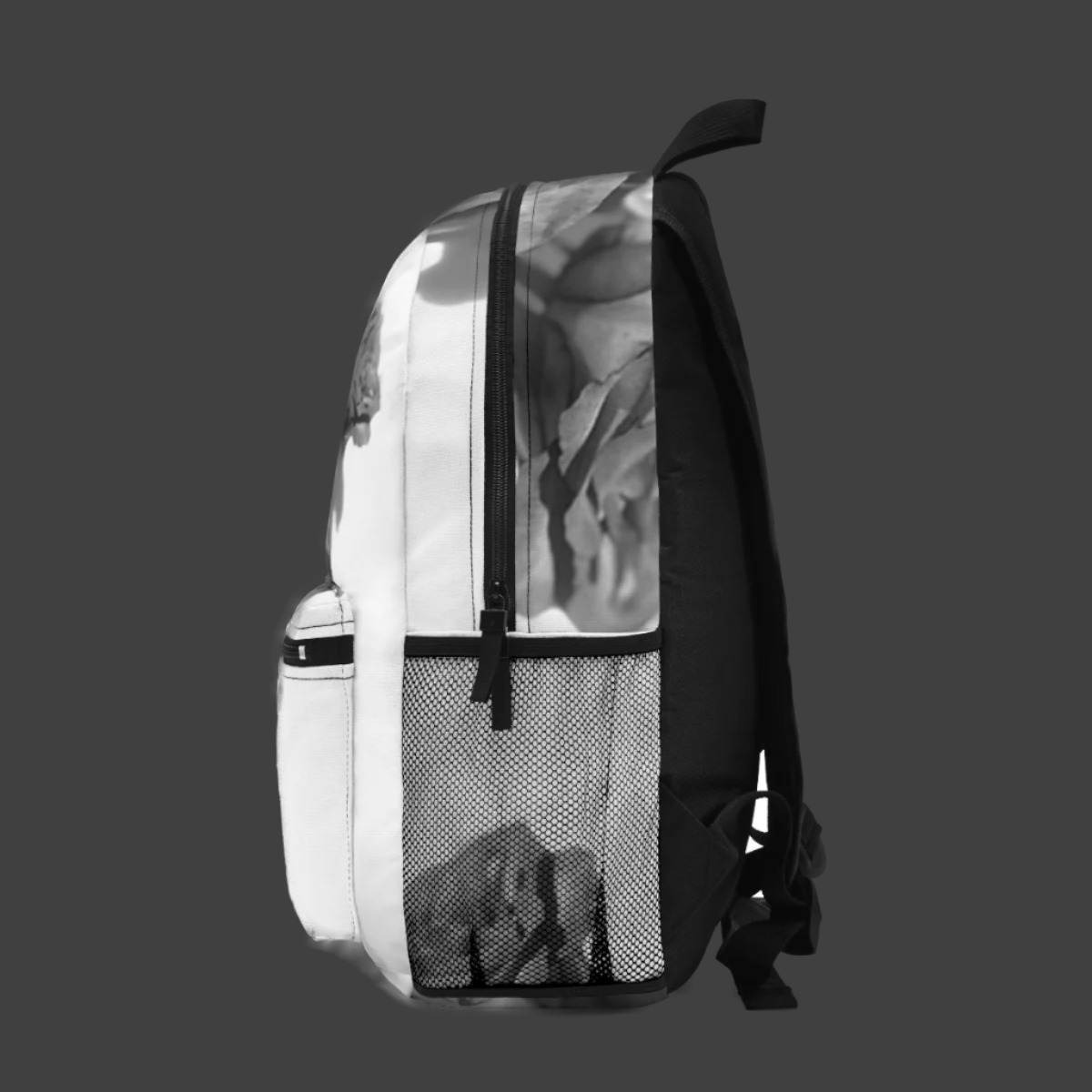 Right side of backpack with elegant greyscale floral pattern and soft rose detailing.