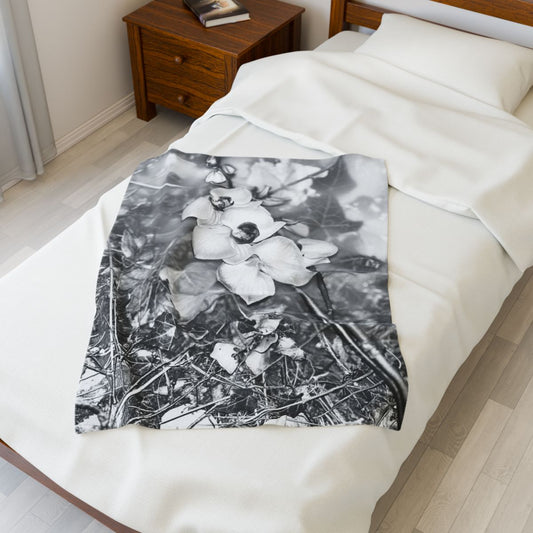 black and white floral throw blanket featuring orchids