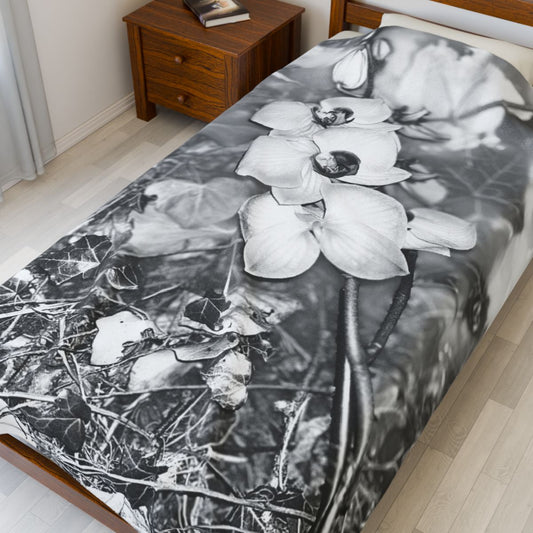 black and white floral throw blanket featuring orchids