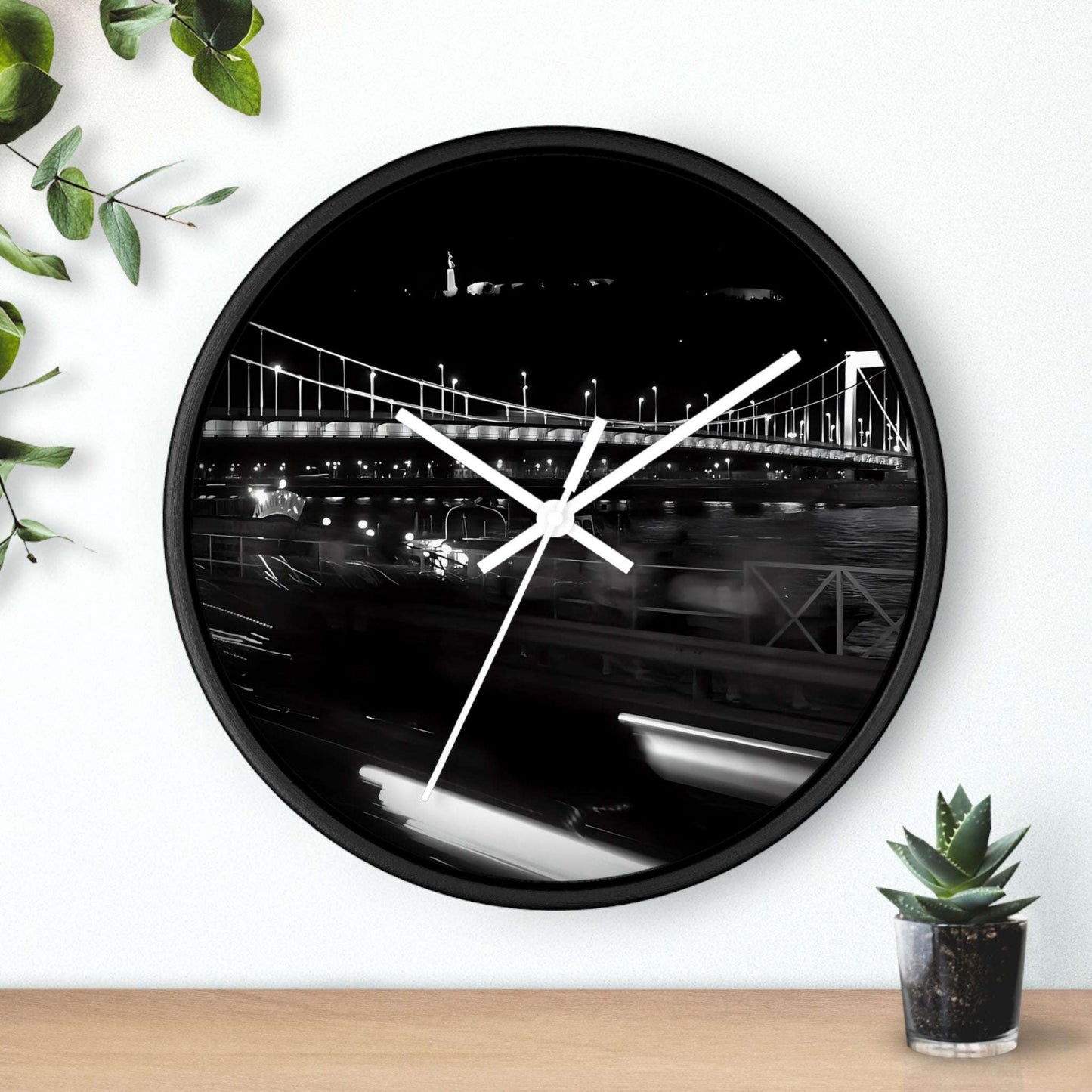 black and white wall clock featuring Budapest by night, bridge over Danube river, and Citadel, base: black: white, handles: white, size: 10''