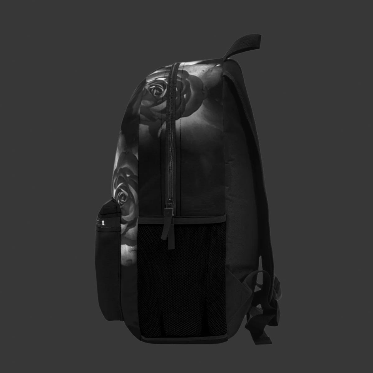 Right angle of the floral backpack, showing shadowed roses and reinforced stitching, with subtle texture in greyscale print.