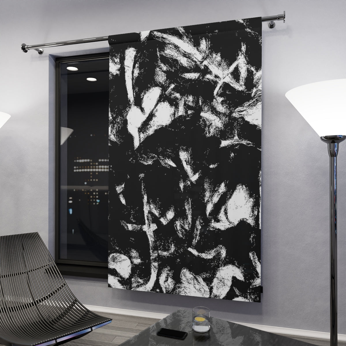 Monochrome variant with clef displayed in a dark modern space, abstract foliage pattern catching light from nearby lamps and night window glow