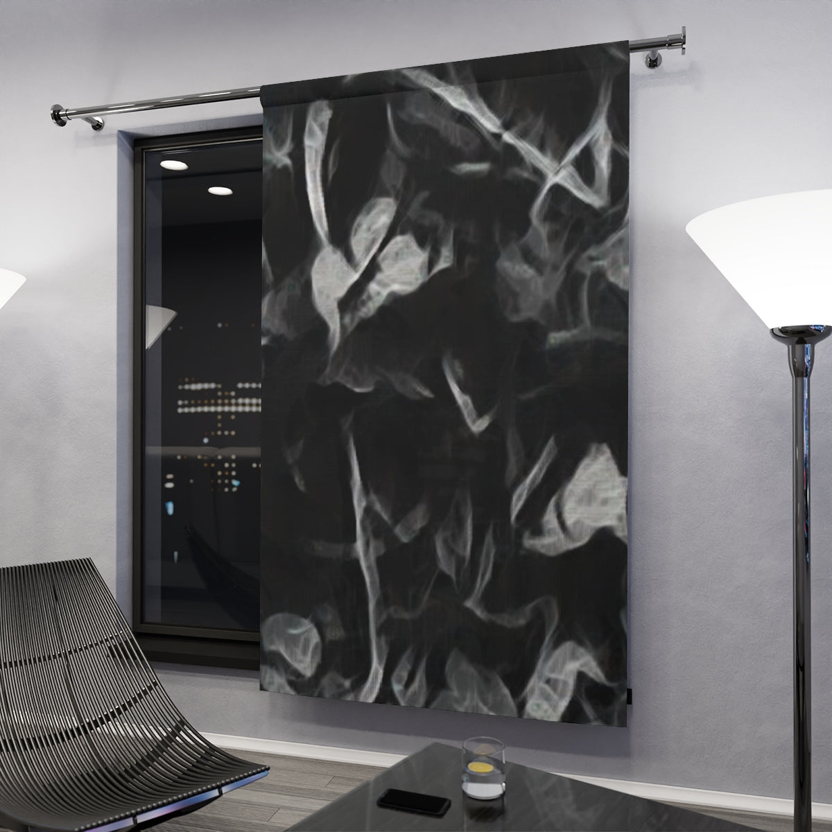 Moody black and grey curtain variant with clef with vaporous leaf silhouettes illuminated subtly by ambient light in a dark modern interior