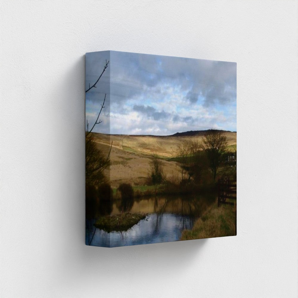 Papi's Canvas Eco-Friendly Wall Art featuring a serene countryside landscape with a reflective pond and cloudy sky