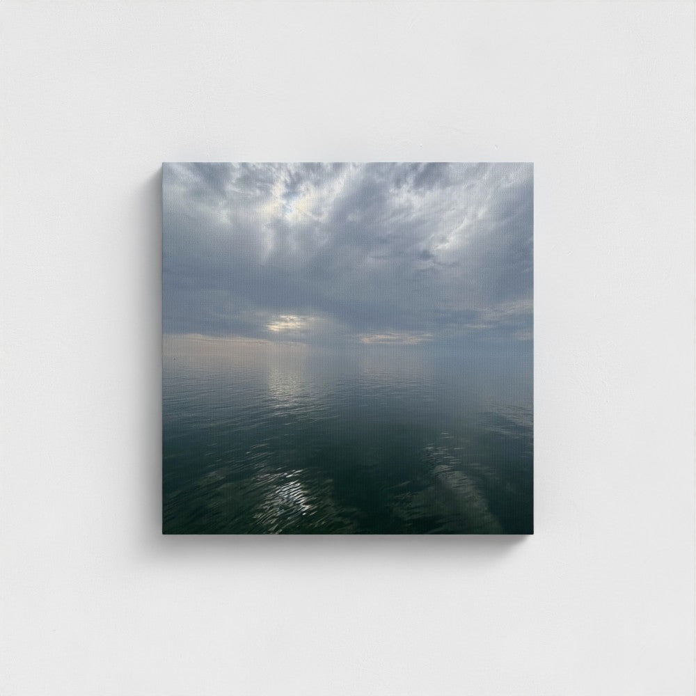 20''x20'' square sustainable canvas art with sea surface perfectly mirroring textured clouds above