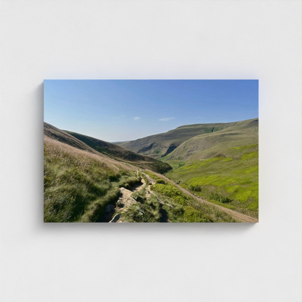 Eco-friendly canvas print showing a rocky path winding through green slopes of the Peak District under a clear blue sky