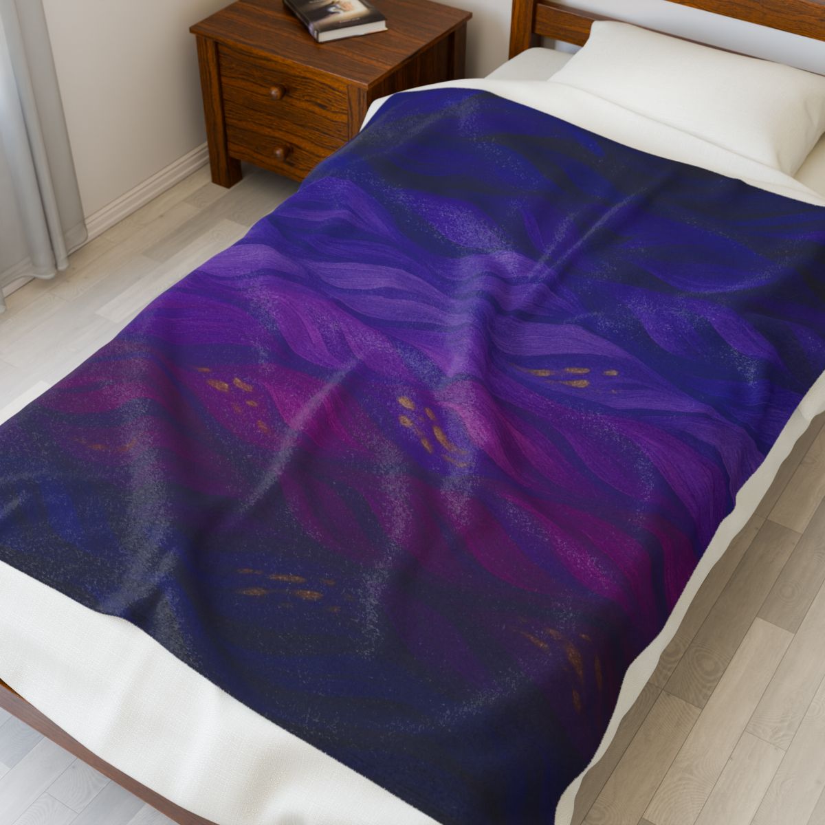Plush throw in full color variant with rich violet, indigo, and crimson hues, draped on a modern wooden bed.