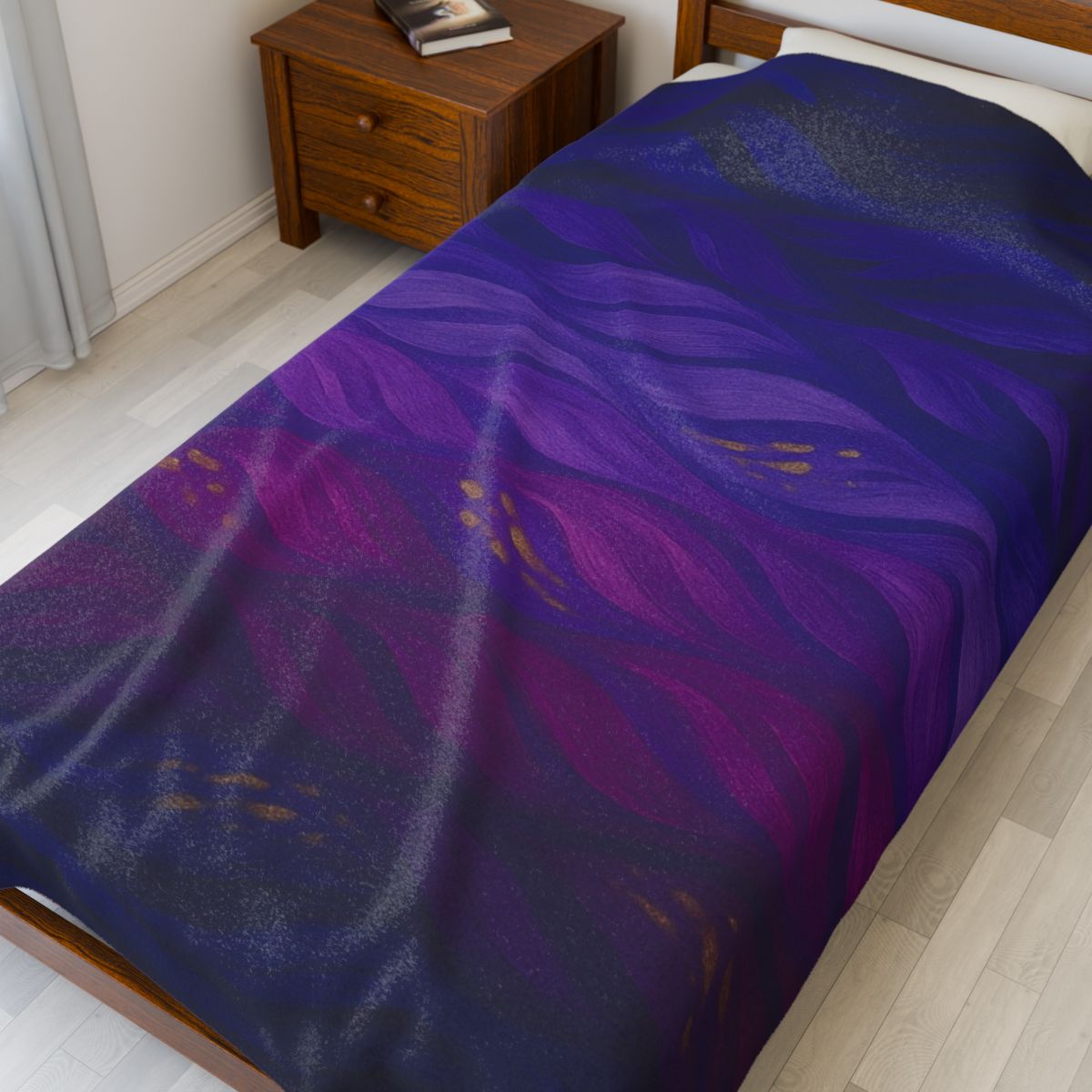 Gilded Amethyst throw in full color, showing dark, layered abstract waves and gold accents across a queen-sized bed