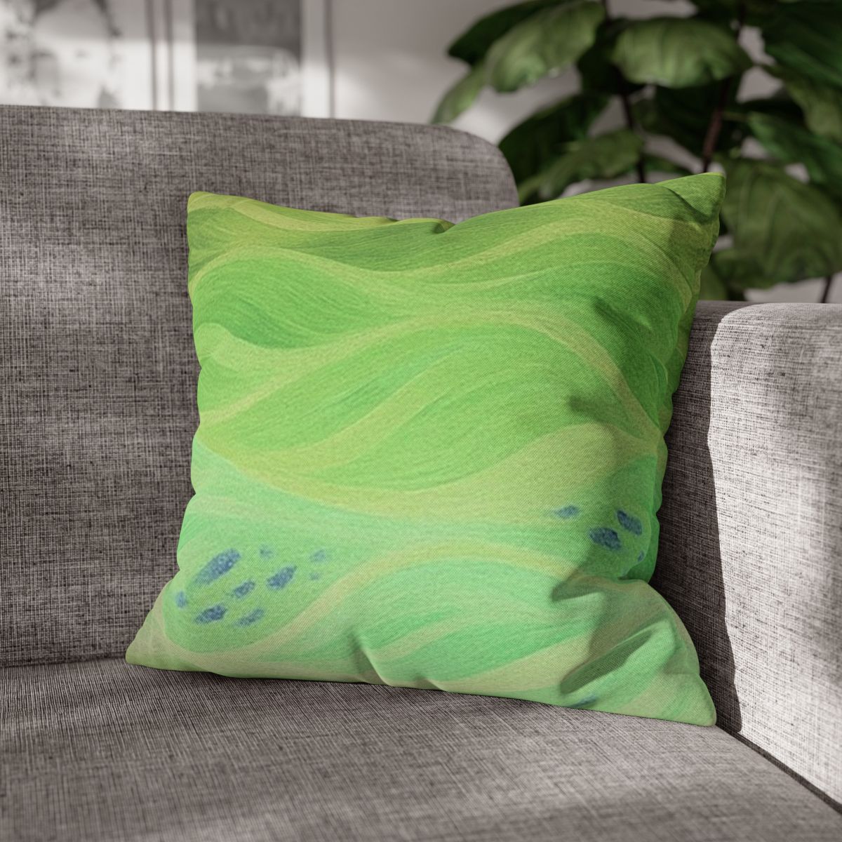18" × 18" Abstract Wave pillowcase in Lemon & Lime placed in the corner of a gray sofa