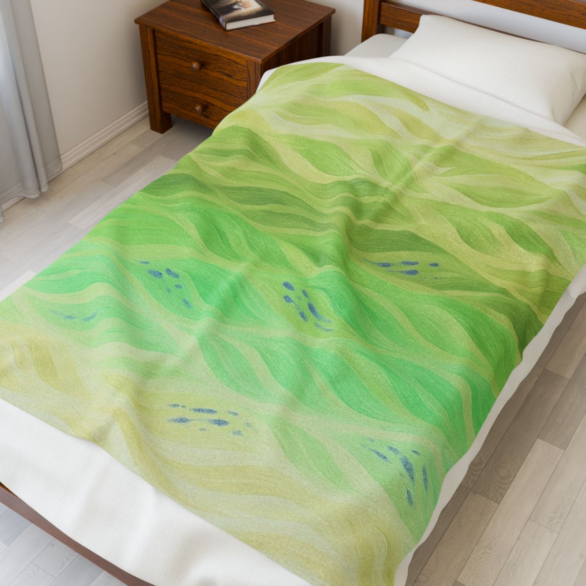 Fresh green throw with soft citrus gradients, shown in natural light on a light-wood frame bed
