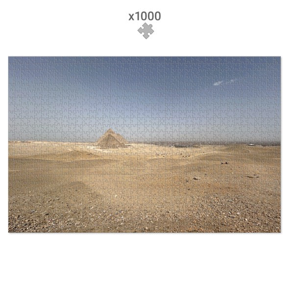 Desert landscape with a pyramid under a clear blue sky, suitable for a puzzle with 1000 pieces.