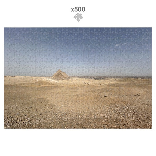 Jigsaw puzzle with a pyramid in the desert and 'x500' label on a white background